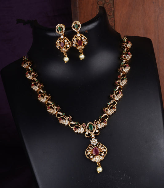 Regal Elegance: A Gold-Toned Kundan Necklace Set with Matching Earrings